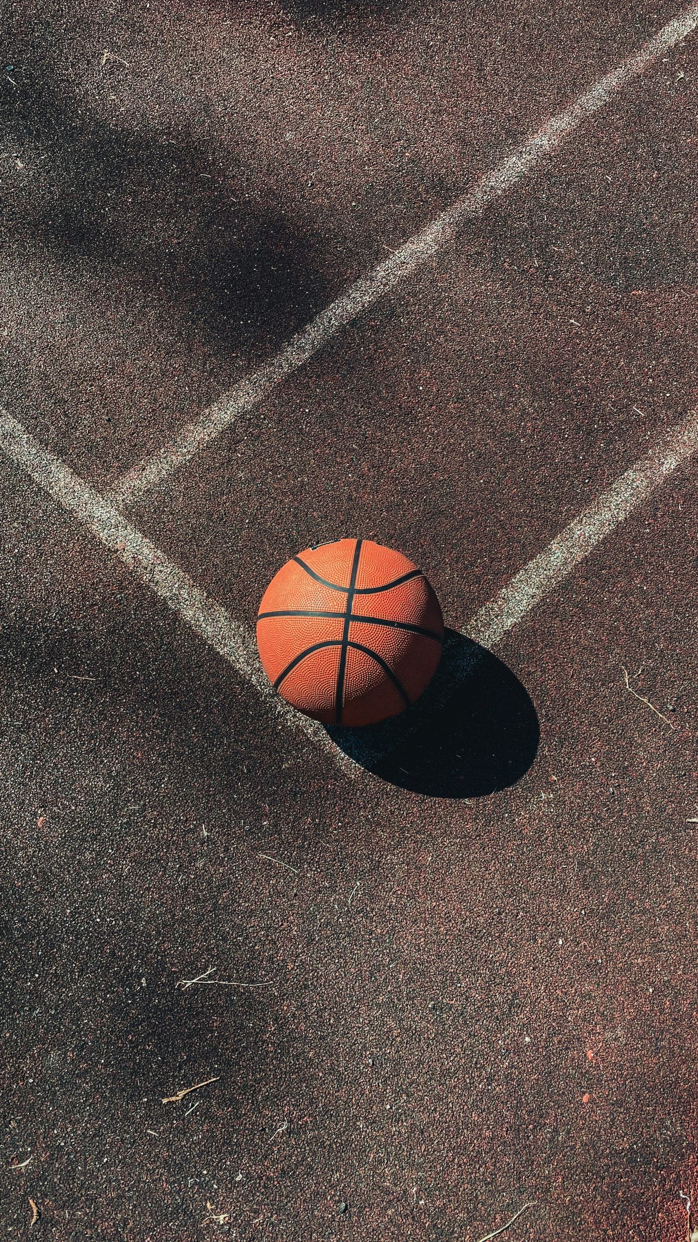 basketball on a blacktop surface for athletes who are moving to utah